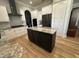 Spacious kitchen with modern appliances, island, beautiful countertops and ample cabinet space at 205 Hazard St, Orlando, FL 32804