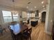 Modern kitchen with white cabinets, stainless steel appliances, and a central island at 205 Hazard St, Orlando, FL 32804