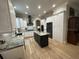 Well-lit kitchen featuring an island, modern appliances and abundant cabinet space at 205 Hazard St, Orlando, FL 32804
