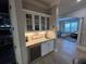 Kitchenette features sink, counter space and wine cooler with glass door cabinets at 205 Hazard St, Orlando, FL 32804