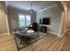 Comfortable sitting area featuring modern chairs, a TV, and natural light at 205 Hazard St, Orlando, FL 32804