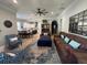 Spacious living room featuring a leather sofa, patterned rug, and ample natural light at 205 Hazard St, Orlando, FL 32804