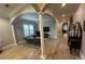 Open-concept living area with stylish furnishings and a hallway leading to the staircase and other rooms at 205 Hazard St, Orlando, FL 32804