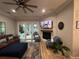 Comfortable living room features a brick fireplace, large TV, and modern furnishings at 205 Hazard St, Orlando, FL 32804