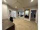 Large, open living space with neutral carpet, and including built-in display case at 205 Hazard St, Orlando, FL 32804