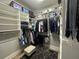 Organized walk-in closet featuring built-in shelving and hanging racks at 205 Hazard St, Orlando, FL 32804