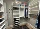 Organized walk-in closet featuring built-in shelving and hanging racks at 205 Hazard St, Orlando, FL 32804