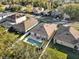 Aerial view showcasing a house with a private pool at 211 Lynn St, Oviedo, FL 32765