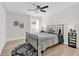 Bedroom with metal bed frame and blue and white bedding at 211 Lynn St, Oviedo, FL 32765