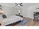 Bedroom with a large bed, rug, and built-in closet at 211 Lynn St, Oviedo, FL 32765