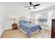 Spacious bedroom with a blue and white comforter and wood flooring at 211 Lynn St, Oviedo, FL 32765