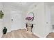 Bright and airy entryway with a glass-top table and mirror at 211 Lynn St, Oviedo, FL 32765