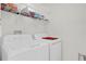 Laundry room with washer, dryer, and shelving at 211 Lynn St, Oviedo, FL 32765