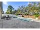 Inviting pool area with patio furniture and lush landscaping at 211 Lynn St, Oviedo, FL 32765