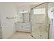 Clean bathroom featuring granite countertop vanity and frameless glass shower stall with tile surround at 240 Blue Starfish Pl, Daytona Beach, FL 32124