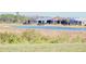 Waterfront community view with houses and lush landscape at 240 Blue Starfish Pl, Daytona Beach, FL 32124