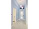 Entryway with light blue walls, tile flooring, and flamingo accents at 240 Blue Starfish Pl, Daytona Beach, FL 32124