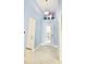 Light and airy entryway with unique flamingo decor at 240 Blue Starfish Pl, Daytona Beach, FL 32124