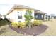 Well-maintained house exterior with landscaped yard and screened patio at 240 Blue Starfish Pl, Daytona Beach, FL 32124