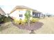 Well-maintained house exterior with landscaped yard and screened patio at 240 Blue Starfish Pl, Daytona Beach, FL 32124