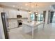 Modern kitchen with stainless steel appliances, granite countertops, and a large center island at 240 Blue Starfish Pl, Daytona Beach, FL 32124