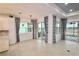 Cozy living room with tile flooring, stylish curtains, and multiple windows, offering ample natural light at 240 Blue Starfish Pl, Daytona Beach, FL 32124