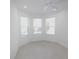 Bright office features recessed lighting, ceiling fan and three large windows at 240 Blue Starfish Pl, Daytona Beach, FL 32124