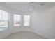 Bright office features recessed lighting, ceiling fan and three large windows at 240 Blue Starfish Pl, Daytona Beach, FL 32124