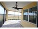 Relaxing screened patio with view and ceiling fan at 240 Blue Starfish Pl, Daytona Beach, FL 32124