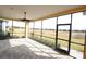 Spacious screened patio with brick flooring and ceiling fan at 240 Blue Starfish Pl, Daytona Beach, FL 32124