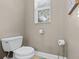 Clean bathroom with toilet and window at 2522 Tree Meadow Loop, Apopka, FL 32712