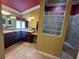 Well-lit bathroom featuring a double vanity, decorative mirrors, and a glass block privacy window at 2544 Ashville Ave, The Villages, FL 32162