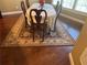 Cozy dining area featuring a table, chairs, and a decorative rug at 2544 Ashville Ave, The Villages, FL 32162