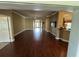 Expansive living room with wood floors, open floor plan, and stylish finishes at 2544 Ashville Ave, The Villages, FL 32162
