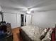 Bedroom featuring a bed, dresser, and ample closet space at 2858 N Powers Dr # 123, Orlando, FL 32818