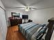 Bright bedroom featuring a comfortable bed and dresser at 2858 N Powers Dr # 123, Orlando, FL 32818