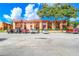 Building exterior view with ample parking at 2858 N Powers Dr # 123, Orlando, FL 32818
