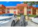 Building exterior showcasing parking and landscaping at 2858 N Powers Dr # 123, Orlando, FL 32818