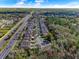 Overhead view of neighborhood street with nearby roads and trees at 2874 Pewter Mist Ct, Oviedo, FL 32765