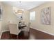 Cozy dining area with modern chandelier and staircase view, perfect for intimate meals at 2874 Pewter Mist Ct, Oviedo, FL 32765