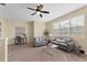 Cozy living room with plush sofas, a ceiling fan, and a bright, airy feel at 2874 Pewter Mist Ct, Oviedo, FL 32765