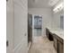 Double vanity bathroom with walk-in shower and tile flooring at 2943 Top Water Way, Kissimmee, FL 34746