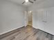 Spacious bedroom with wood-look floors and double doors at 2943 Top Water Way, Kissimmee, FL 34746