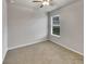 Well-lit bedroom featuring carpet and ceiling fan at 2943 Top Water Way, Kissimmee, FL 34746