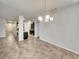 Spacious dining area with chandelier and view of kitchen at 2943 Top Water Way, Kissimmee, FL 34746