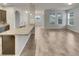 Open kitchen with granite countertops and stainless steel appliances at 2943 Top Water Way, Kissimmee, FL 34746