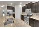 Modern kitchen with stainless steel appliances and granite countertops at 2943 Top Water Way, Kissimmee, FL 34746