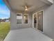 Covered patio with ceiling fan and view of backyard at 2943 Top Water Way, Kissimmee, FL 34746