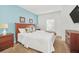 Spacious bedroom with a wooden bed frame and light-colored walls at 2956 Lucayan Harbour Cir # 107, Kissimmee, FL 34746