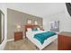 Bright bedroom with a queen-size bed, nightstands, and a large mirror at 2956 Lucayan Harbour Cir # 107, Kissimmee, FL 34746